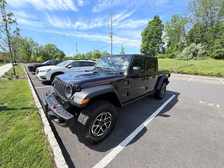 Black Jeep Gladiator with a deep, clear finish after correction