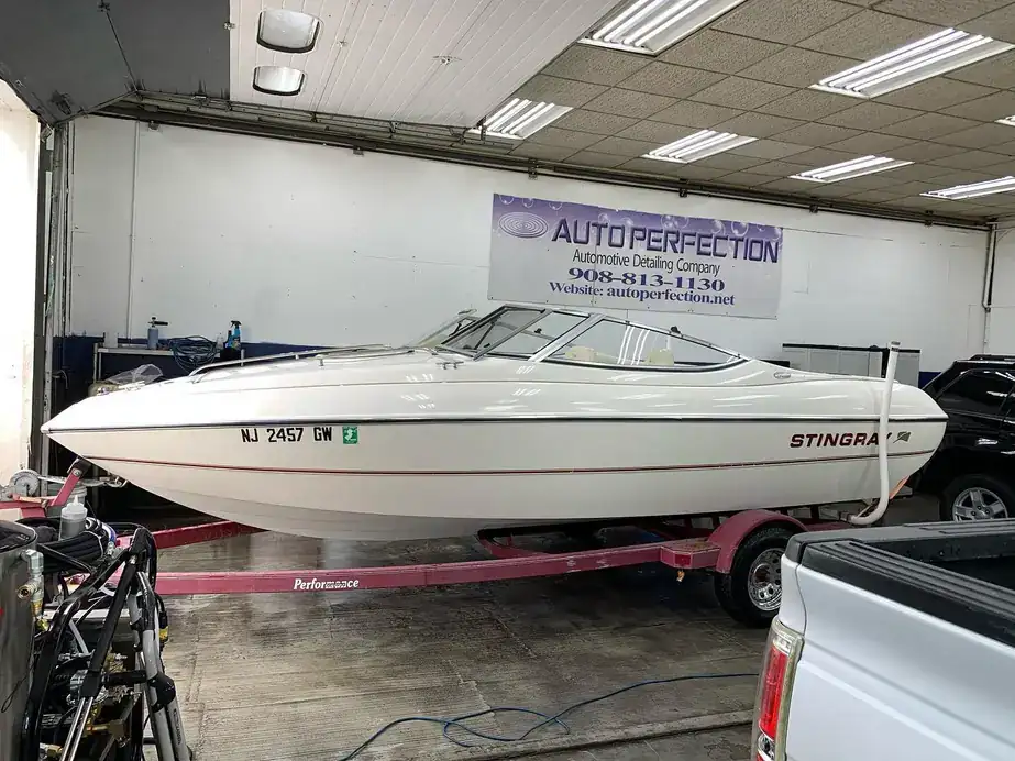 Stingray boat on its trailer inside the detailing bay